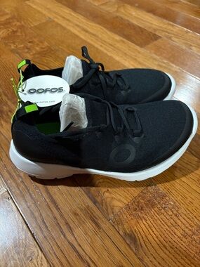 OOFOS Black Slip-On Knit Sneakers with Neon Green Sole and Neon Green Accents